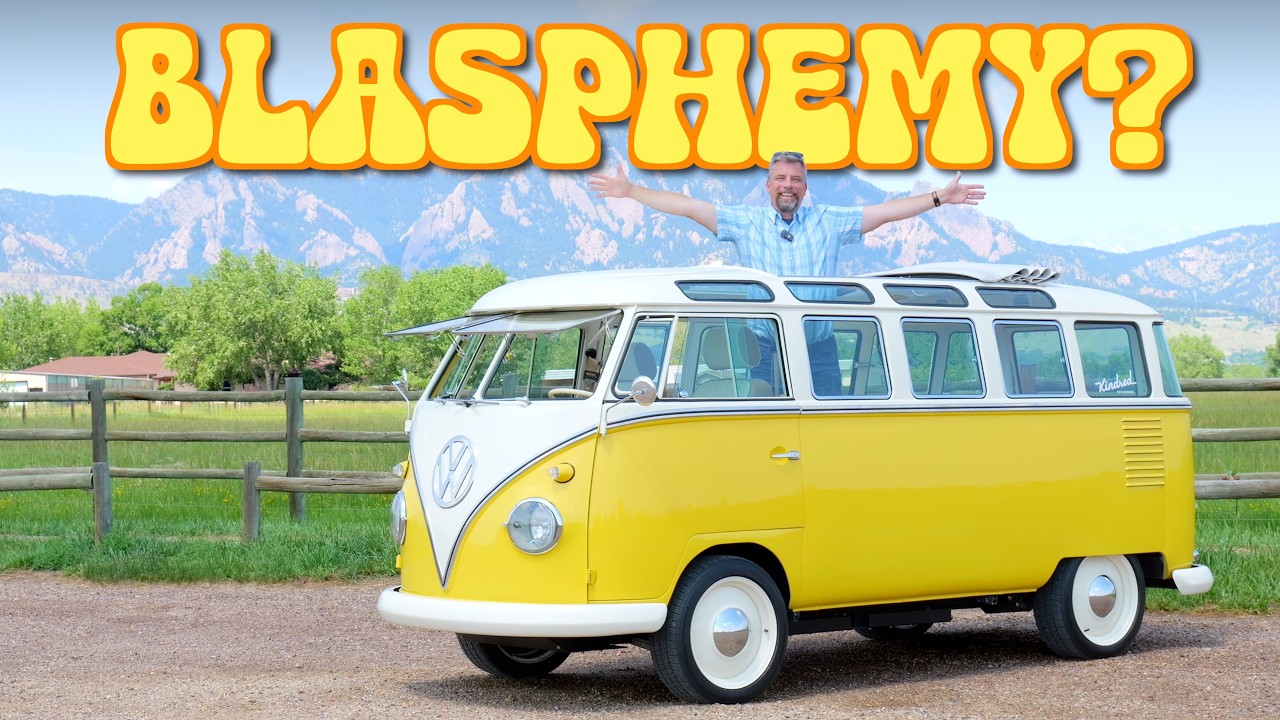 Restored electric Volkswagen microbus on a mountain road