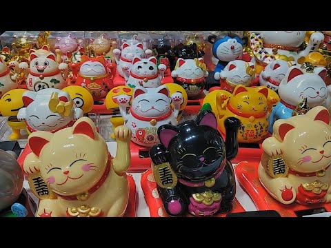 Traditional Maneki Neko lucky cat figurine on display | Hong Kong