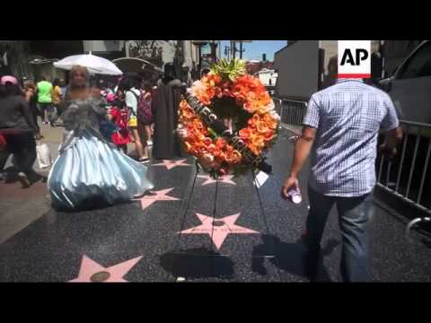 A wreath and flowers adorn late actor James Garner's star on the Hollywood Walk of Fame