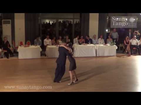  Kostas Nikolaidis  and  Vassia Thanopoulou  are  dancing  to  the  tango  "  El Puntazo  "  by  Juan D'Arienzo  at  Sunny Tango Festival  in  2013