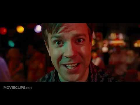 Trailer image: neon club palette tied to synth-pop cues in the film