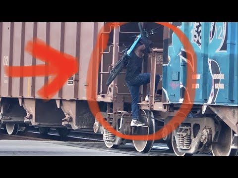 Man Hops Moving Train With Bicycle!  Most Dangerous Train Hopping Ever!  Florida East Coast Railway! Video