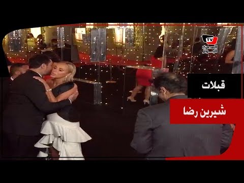 شرين رضا تقبل أحمد الفيشاوي وسميح ساويرس في ختام مهرجان الجونة