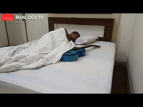 RIZAL OCU DAN GITAR TERCIDUK