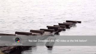 Rain drops falling on a pier