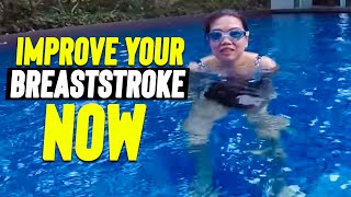 Beginner girl improving her breaststroke