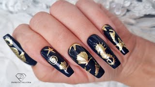 Black and gold summer nails. Seahorse and shell nail art.