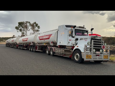 Truck driver reversing 2 trailers + a dolly to make up a 4 trailers Road Train