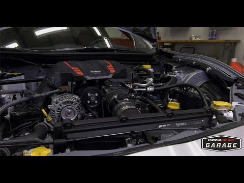 Part of a video titled Can You Install A Supercharger In Your Home Garage? - YouTube