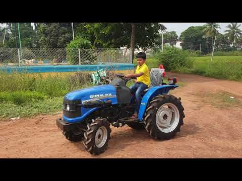 Small tractor with small boy😍