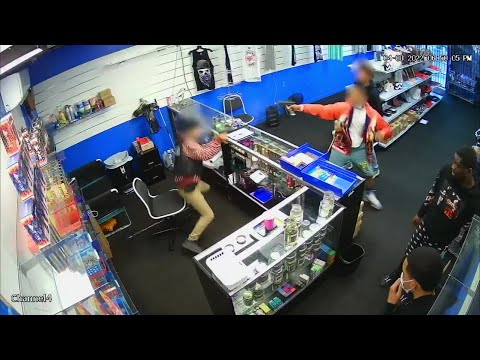 VIDEO: Gun battle breaks out between store employee and would-be robbers