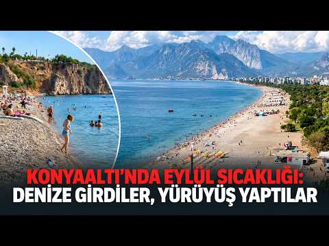 Konyaaltı'nda Eylül sıcaklığı: Denize girdiler, yürüyüş yaptılar
