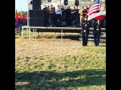 Officer N.Camacho singing The National Anthem