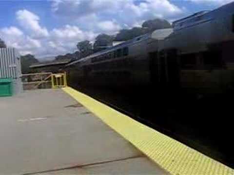 MBTA Commuter rail to boston flies by Wollaston with an F40