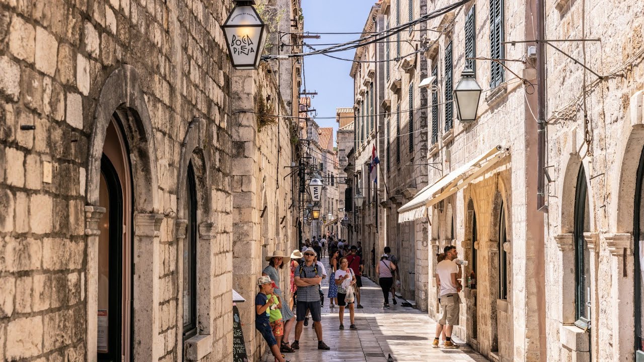 Immersive street-level walking tour through Dubrovnik, Croatia, showcasing authentic urban landscapes, local architecture, and the vibrant atmosphere of the city's neighborhoods
