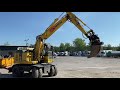 661315 Komatsu PW148-8 Wheeled excavator with trailer }}