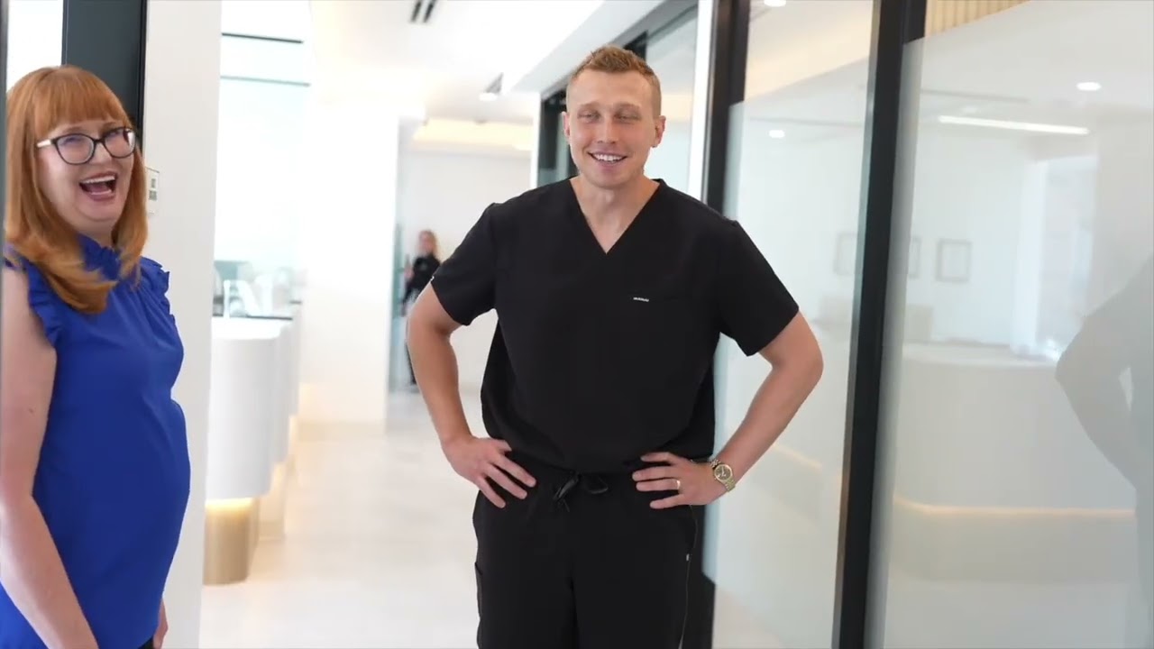 Dentist and patient with message Welcome to Landmark Dental Studio