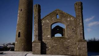 Round Tower and Ruined Church. Near Bryanstown, County Kildare, Ireland.