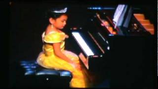 Mari as "Belle" playing "Beauty and the Beast" on the piano