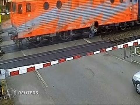 Watch: Man walks away after being hit by train