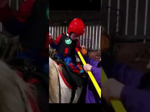 Logan putting toy in Net