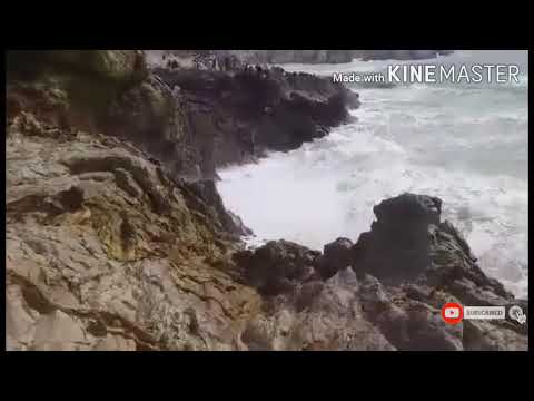 Big ocean waves crashing into rocks