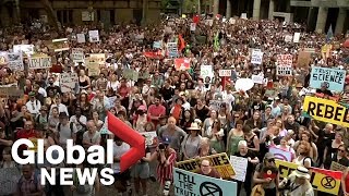 Thousands of Australians protest over climate change policy as bushfires rage