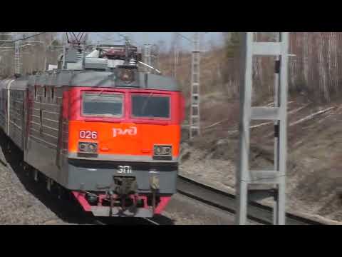 Trains pass by, heavy wheel clatter.