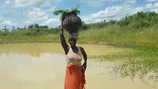 African Village Life/ Woman Fetching Water