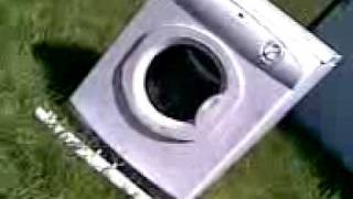 Guy in tumble dryer smashed by sledge hammer weilding maniac