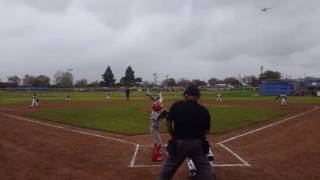 Aiden takes kid throwing gas deep for ground rule double.