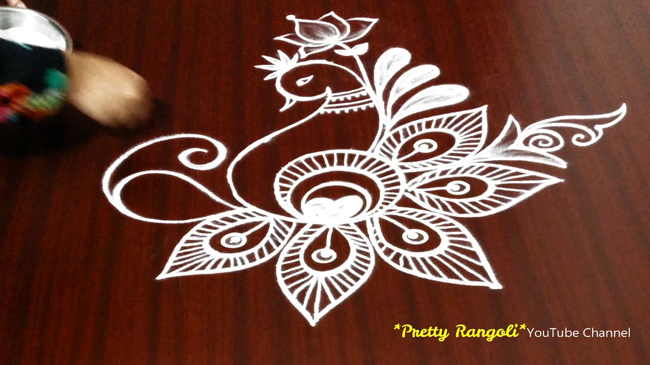 attractive peacock rangoli design by pretty rangoli