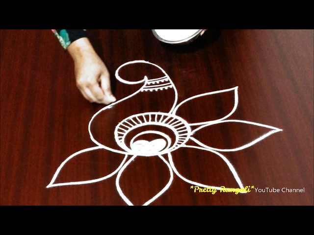 Attractive peacock rangoli design by pretty rangoli