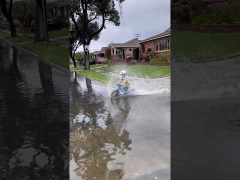 Puddle Play 💦 - When it rains, find the biggest puddle! #rainyday #childhoodmemories  #kidsonbikes