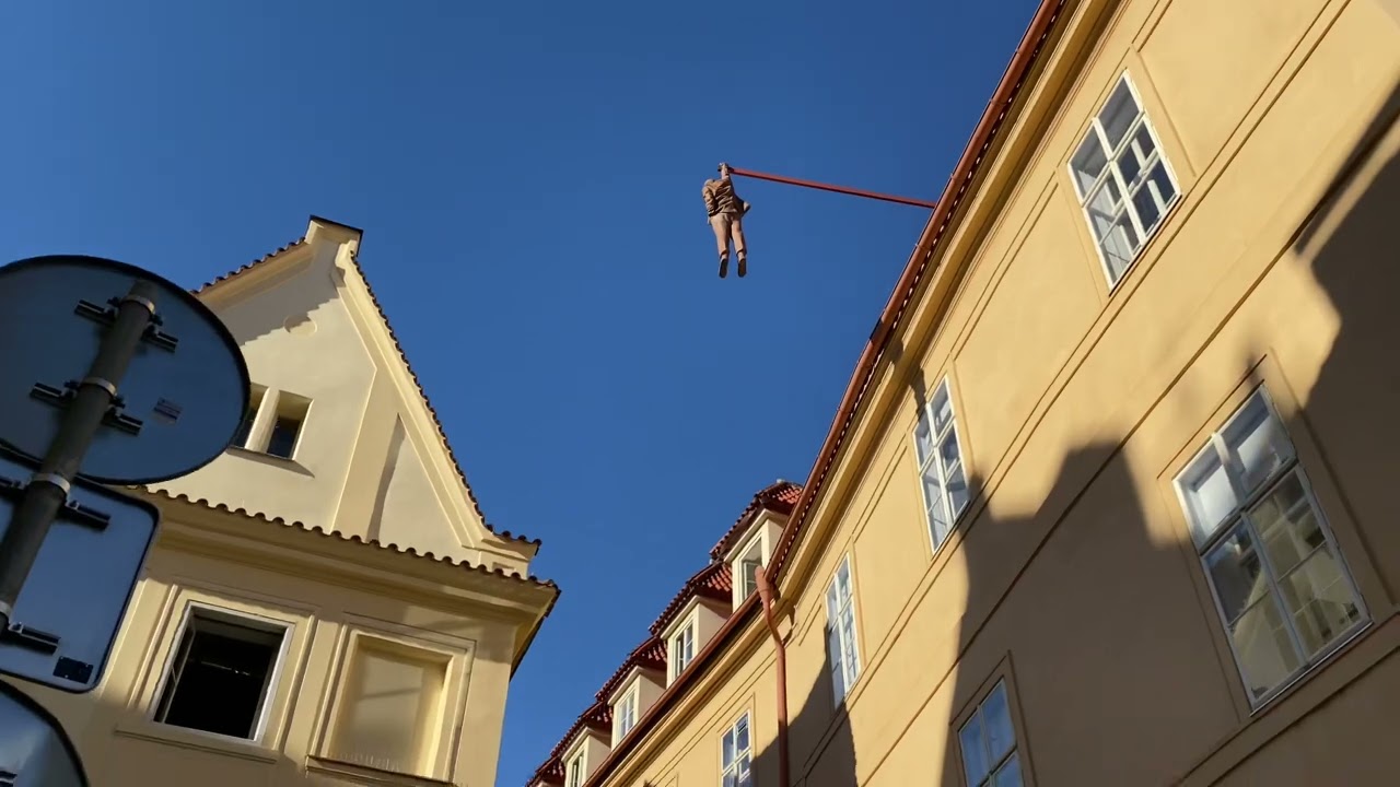 Catch a peek of Man Hanging Out sculpture.