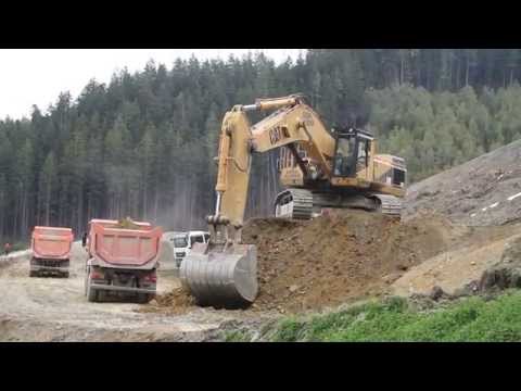 Caterpillar CAT 375 ME loading trucks