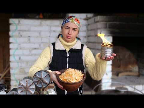 The Woman lives in village. Cooking Ukrainian cabbage Soup. She makes trench candles for army