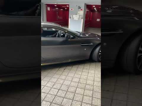 Rich people car in London taking to house via lift  Aston Martin.