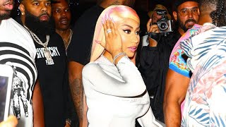 Nicki Minaj is surrounded by bodyguards arriving to Mr. Jones in Miami during Super Bowl Weekend