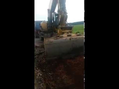 Caterpillar M316D loading Truck