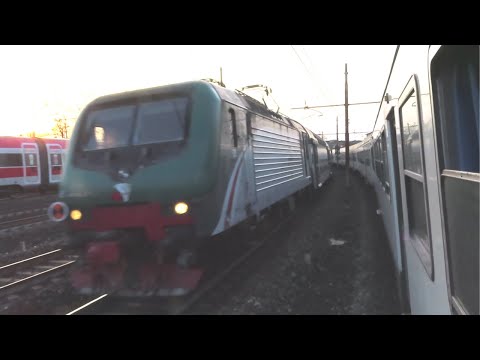 Italy: Two Trenord Class E464 hauled passenger services pass on the Milano outskirts