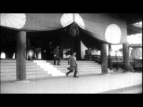 Japanese Emperor Hirohito and Empress Kojun depart the Yasukuni Shrine in Tokyo a...HD Stock Footage