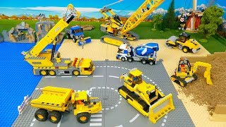 Construction vehicles build a Lego Bridge