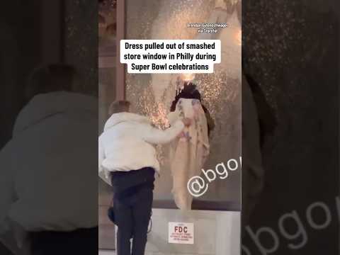 Dress pulled out of smashed store window in Philly during Super Bowl celebrations #shorts