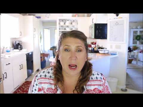 Part of a video titled Slipcover Hack | How To Inexpensively Cover a Sofa