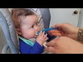 baby eating pablum. first bite of sonething solid