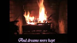 Listening to Try to Remember with lyrics in front of a fireplace