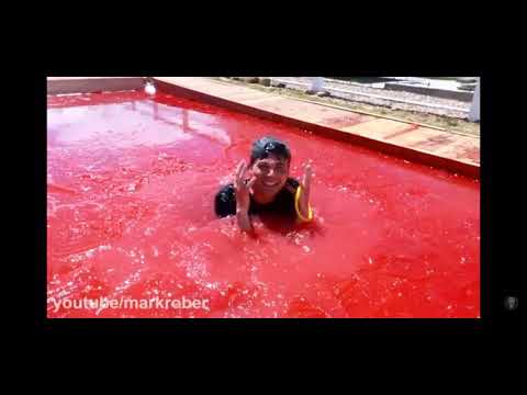 Mark rober swimming in a pool of jello