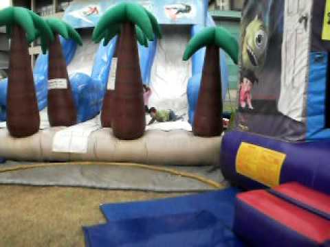 Doron and Dani having fun on the jumping castle slide