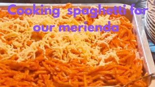 Cooking spaghetti for our merienda